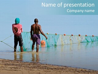 Mozambican Fishermen Pulling A Fishing Net From The Water PowerPoint Template