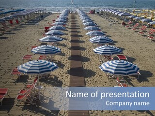 A Beach Filled With Lots Of Blue And White Umbrellas PowerPoint Template