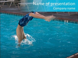 Young Boy Diving Head First Into A Swimming Pool With Head In The Water And Feet Still In The Air PowerPoint Template
