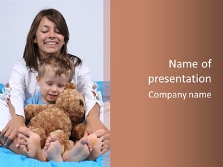 A Woman And A Child Sitting On A Bed With A Teddy Bear PowerPoint Template