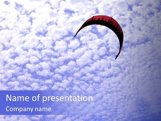 A Kite Surfers Kite Flying In A Cloudy Sky PowerPoint Template