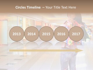 Shopping Young Woman Smiling In The Shopping Mall. PowerPoint Template
