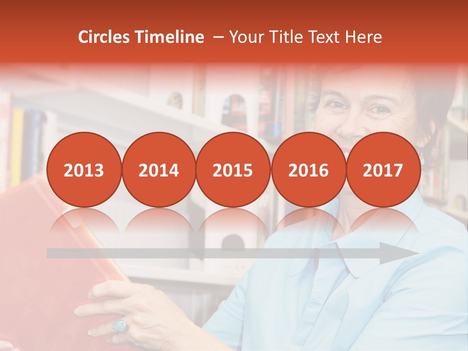 A Pretty Librarian In Her Wheelchair Shelving Books. PowerPoint Template