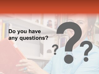 A Pretty Librarian In Her Wheelchair Shelving Books. PowerPoint Template