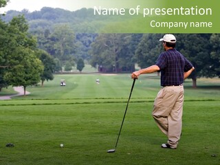 Golfer Waiting For The Fairway To Clear So That He Can Make His Drive From The Tee Box. PowerPoint Template