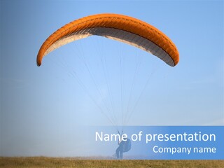 Paraglider Landing In A Field PowerPoint Template