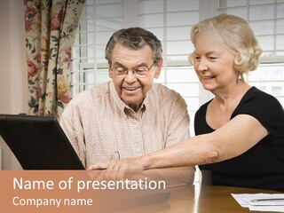 Mature Caucasian Couple Looking At Laptop. PowerPoint Template