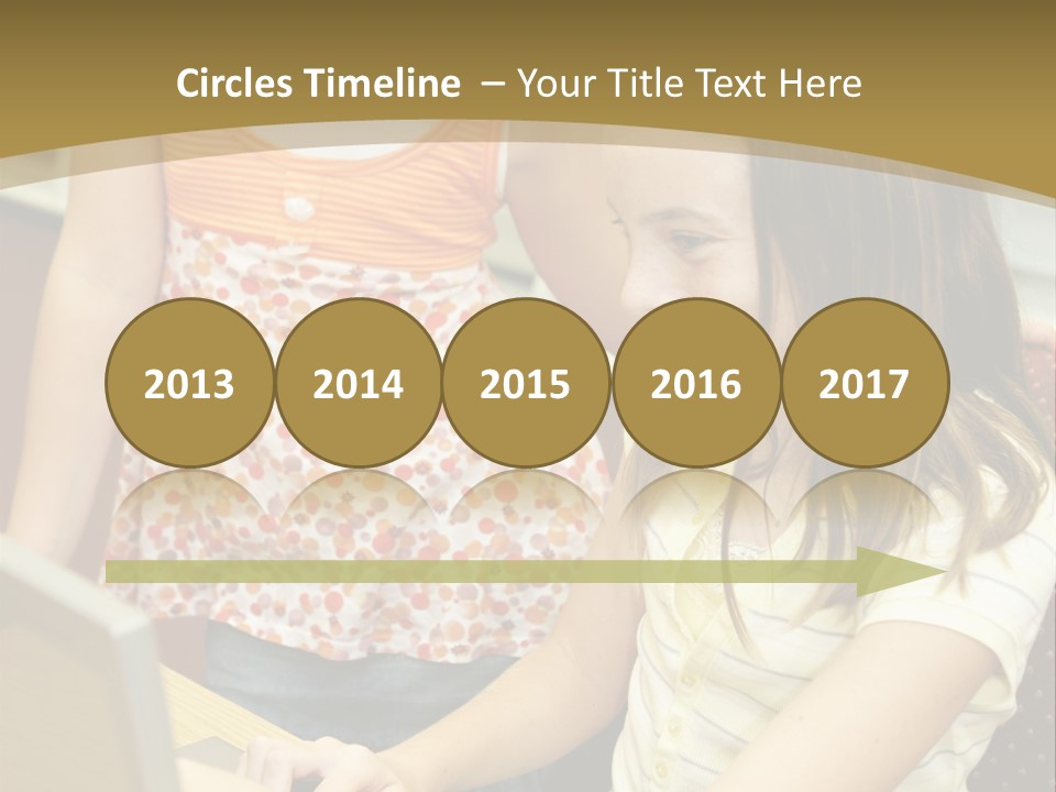 Two Cute School Girls Doing Research On-Line In The School Library. Focus On The Girl Sitting Down. PowerPoint Template