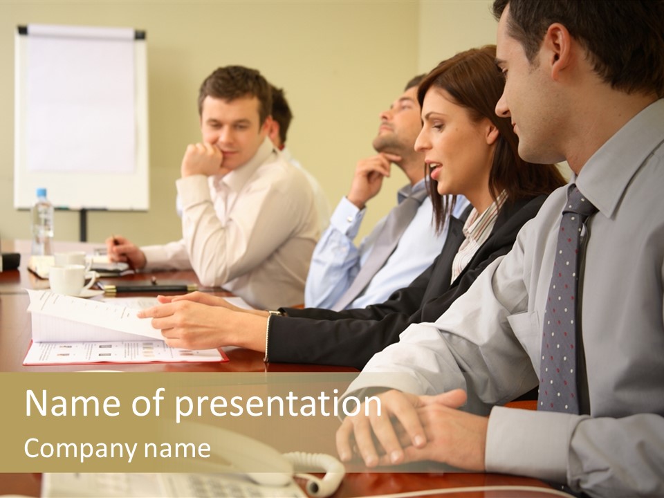 Group Of Business People Working Together At The Informal Meeting, Focus On Man In Foreground. PowerPoint Template