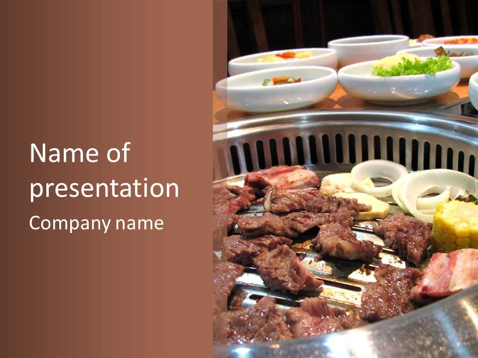 A Large Metal Pan Filled With Food On Top Of A Table PowerPoint Template