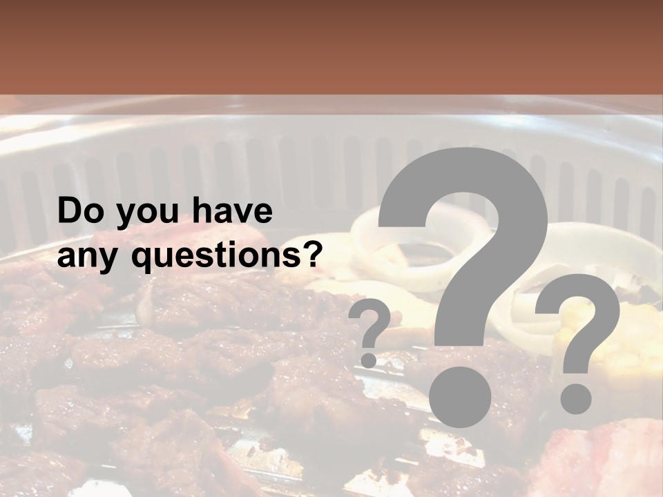 A Large Metal Pan Filled With Food On Top Of A Table PowerPoint Template