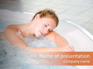 Pretty Blond Woman Relaxing In The Whirlpool PowerPoint Template