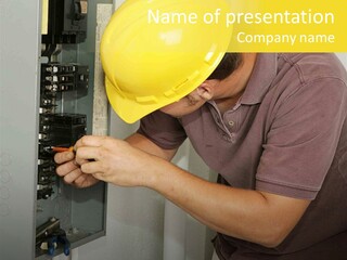 A Man In A Hard Hat Working On An Electrical Panel PowerPoint Template