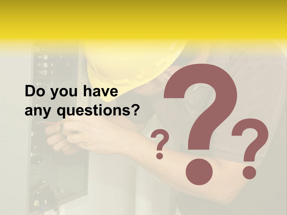 A Man In A Hard Hat Working On An Electrical Panel PowerPoint Template