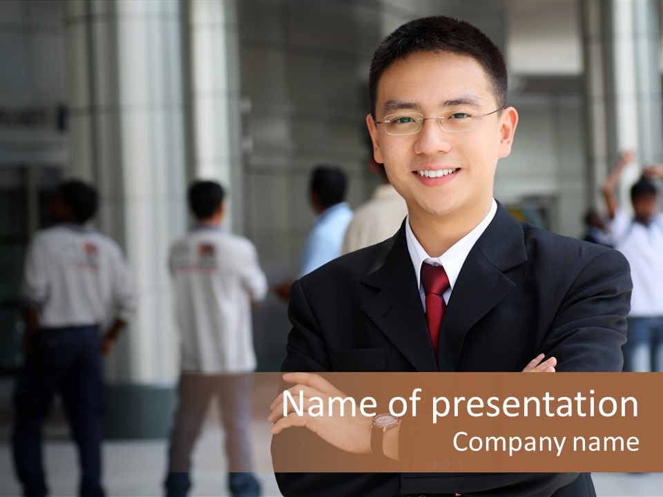 Good Looking Asian Business Man Standing With Arms Folded. PowerPoint Template