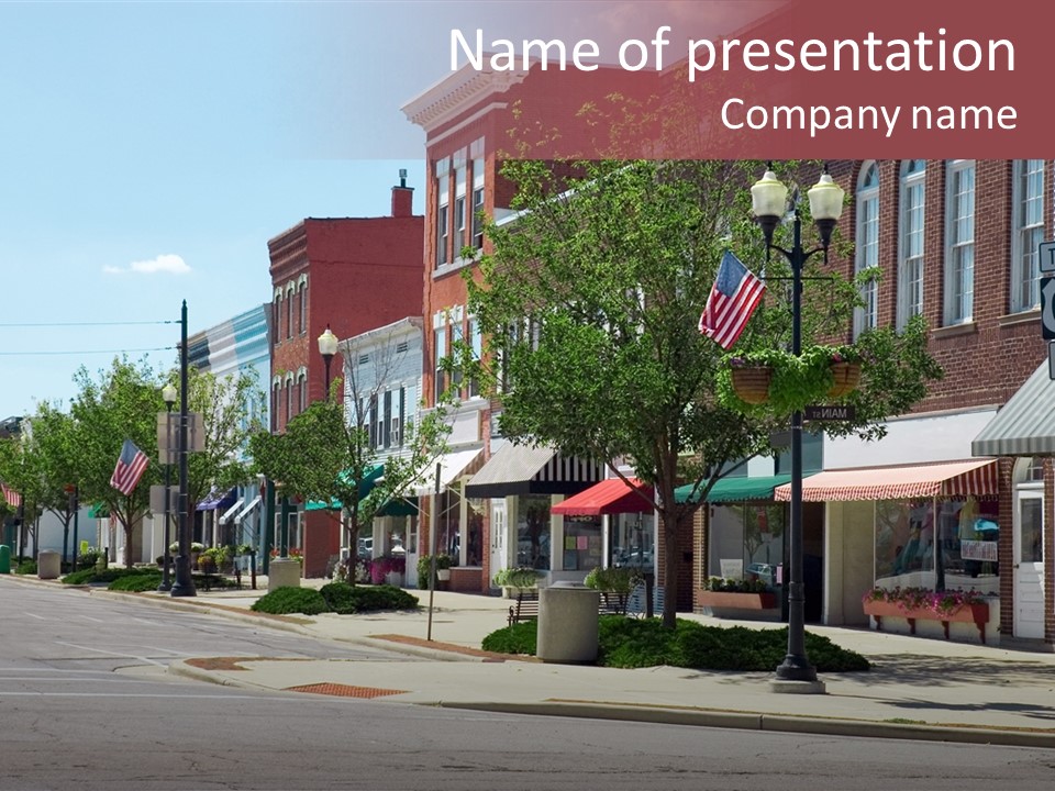 A Main Street In A Typical Midwest Small Town, Complete With U.s. Flags. PowerPoint Template