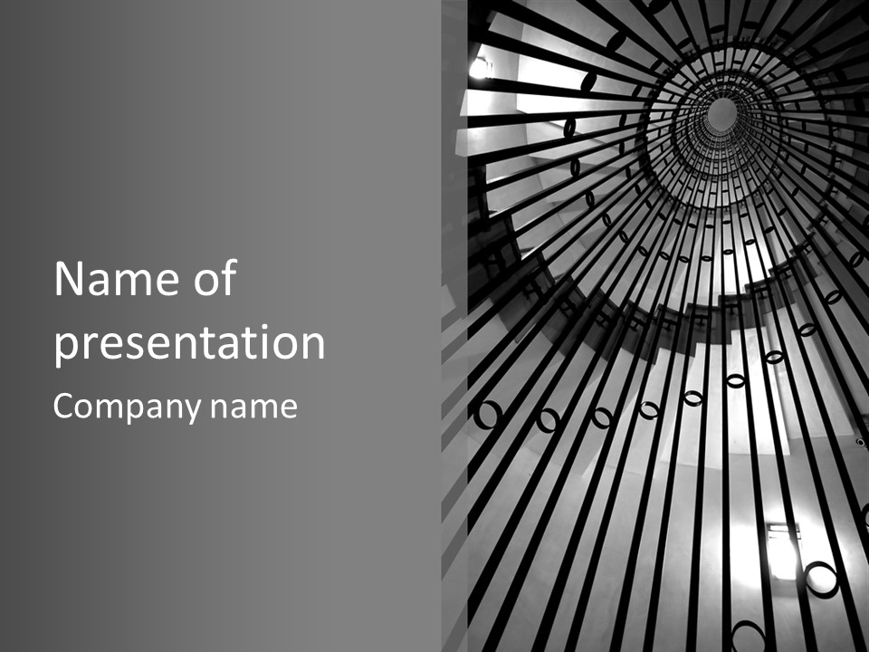 A Black And White Photo Of A Spiral Staircase PowerPoint Template