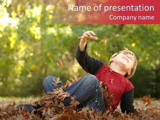 Autumnal Joy: An Active Child Falls Backwards In Autumn Foliage. PowerPoint Template