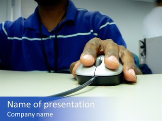 Close Up Photo Of A African American Workers' Hand On A Computer Mouse While Sitting At His Desk PowerPoint Template