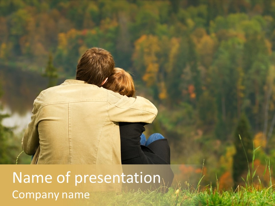 Sweet Couple Sitting On A Hill And Looking At The Autumn Landscape PowerPoint Template