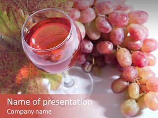 Glass Of Rose Wine And Rose Grapes. Low Dof, Focal Point Is On Wine PowerPoint Template
