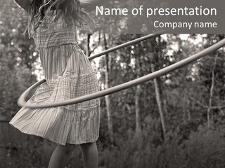 Young Girl Twirling Hula Hoop Outdoors In Sepia For Vintage Look PowerPoint Template