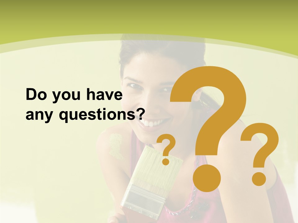 Pretty Smiling Woman Kneeling In Front Of Partially Painted Wall Holding Paintbrush. PowerPoint Template