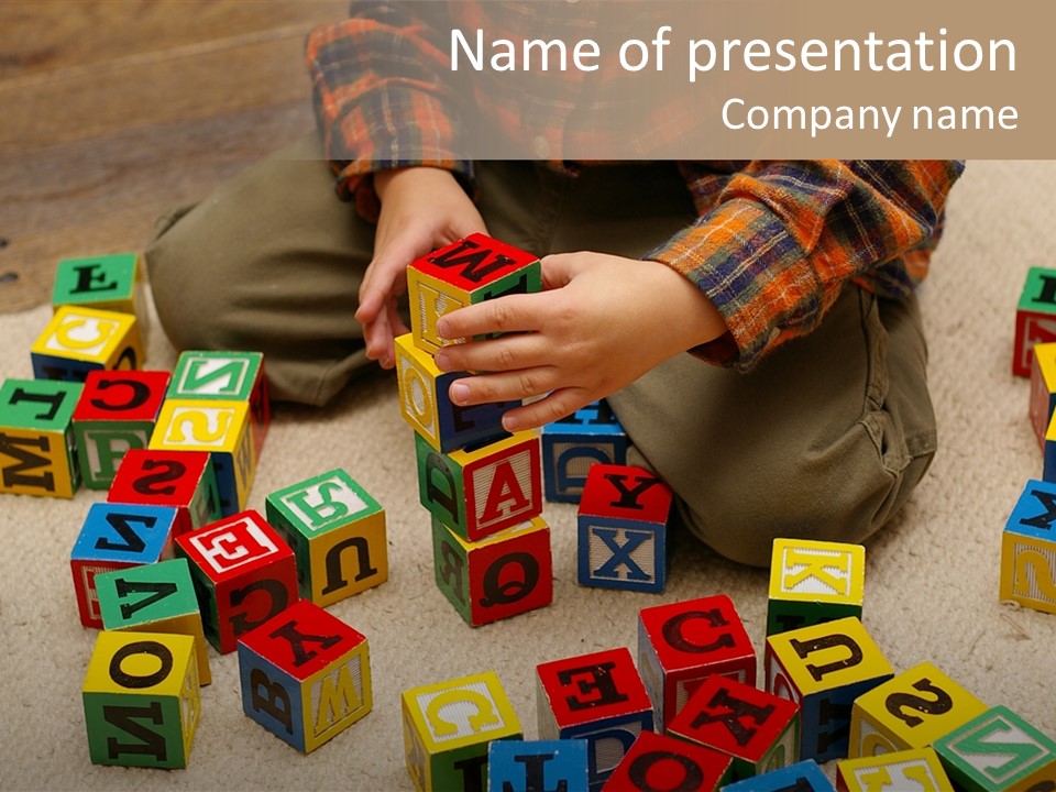 A Child Playing With Wooden Blocks On The Floor PowerPoint Template