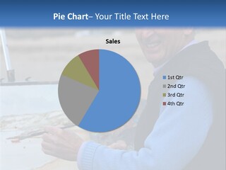 Mature Artist Painting A Coastal Landscape With Paintbrush, Easel And Painter's Palette. PowerPoint Template