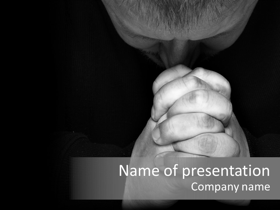 A Man Is Praying With His Hands Together PowerPoint Template