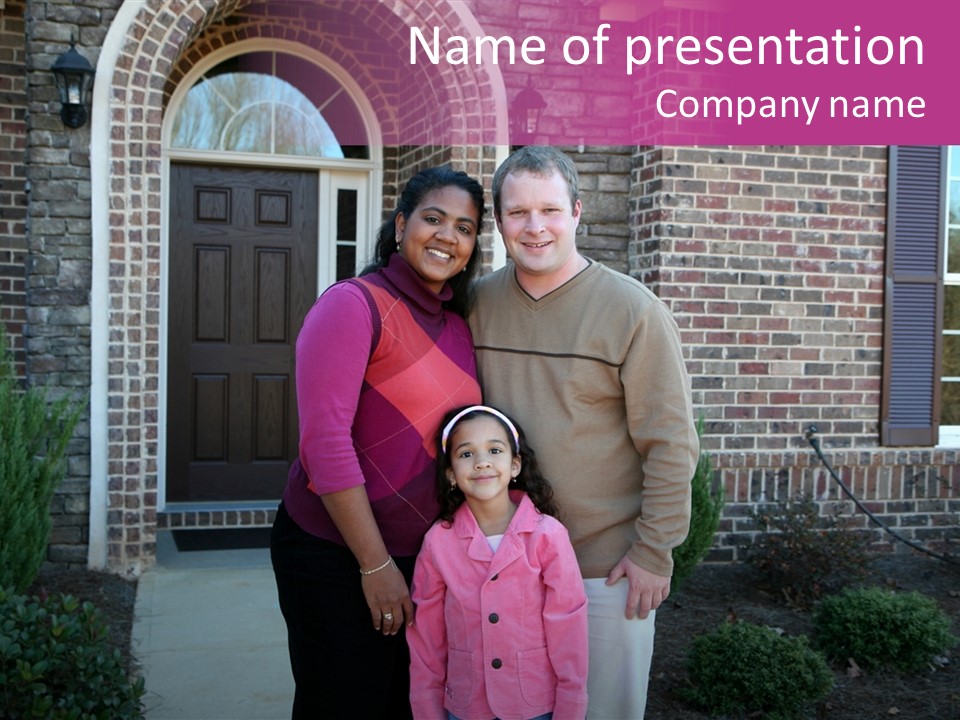 A Family Standing In Front Of Their Home PowerPoint Template