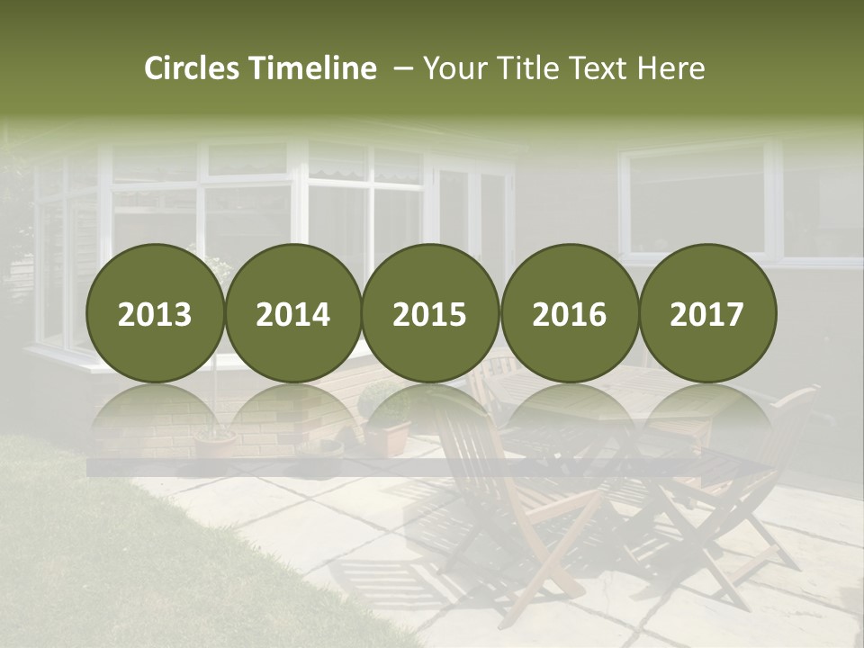A Patio With A Table And Chairs In Front Of A House PowerPoint Template