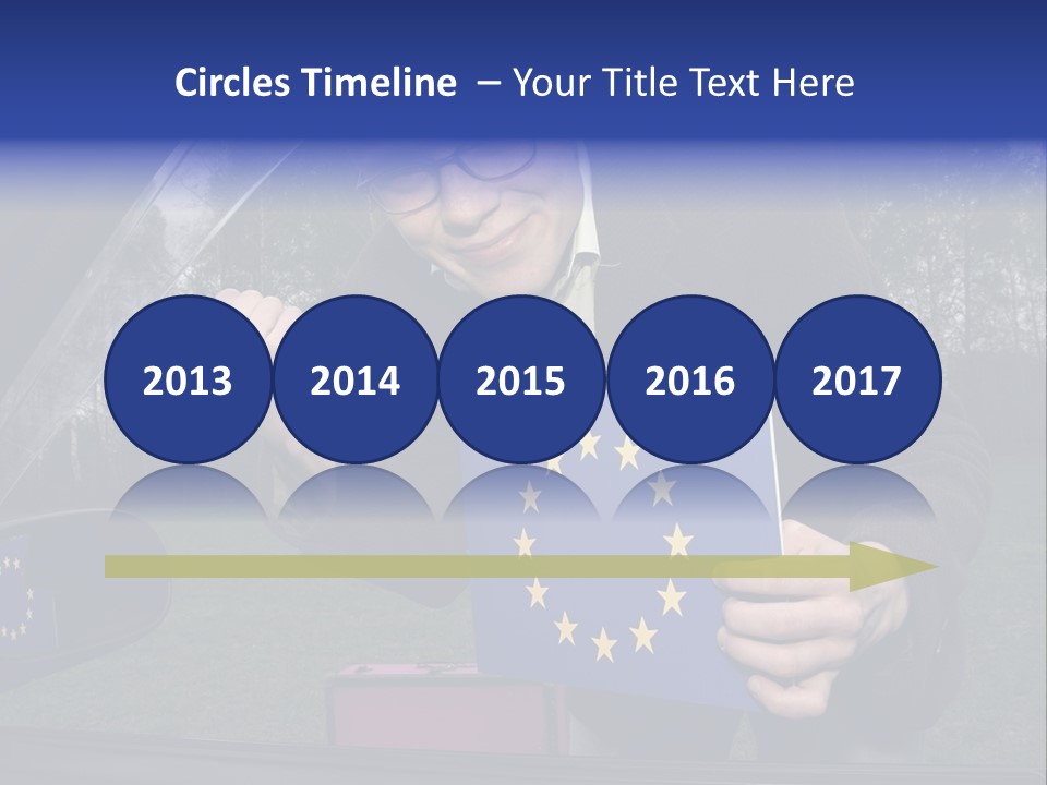 A Man Holding A Blue Box With A European Flag On It PowerPoint Template