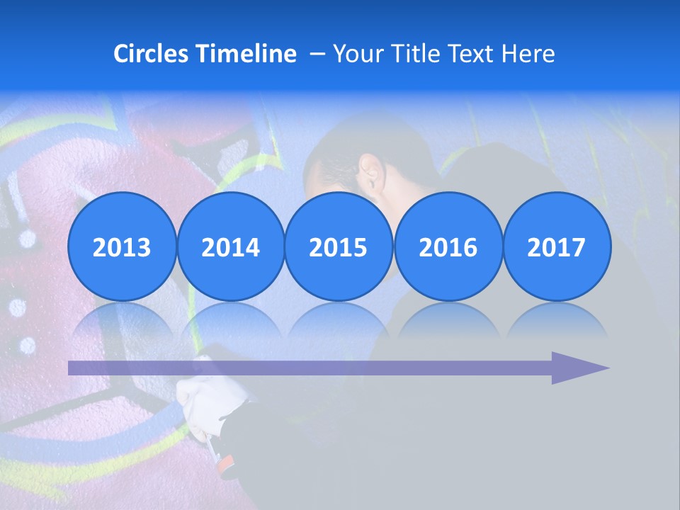 A Man In A Hoodie Writing On A Wall With Graffiti PowerPoint Template