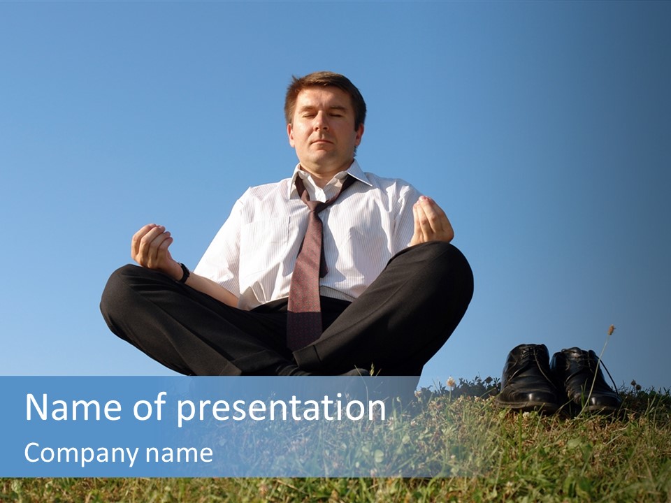 Businessman Wearing White Shirt And Tie Meditating On Grass With His Shoes Off Over Clear Blue Sky PowerPoint Template