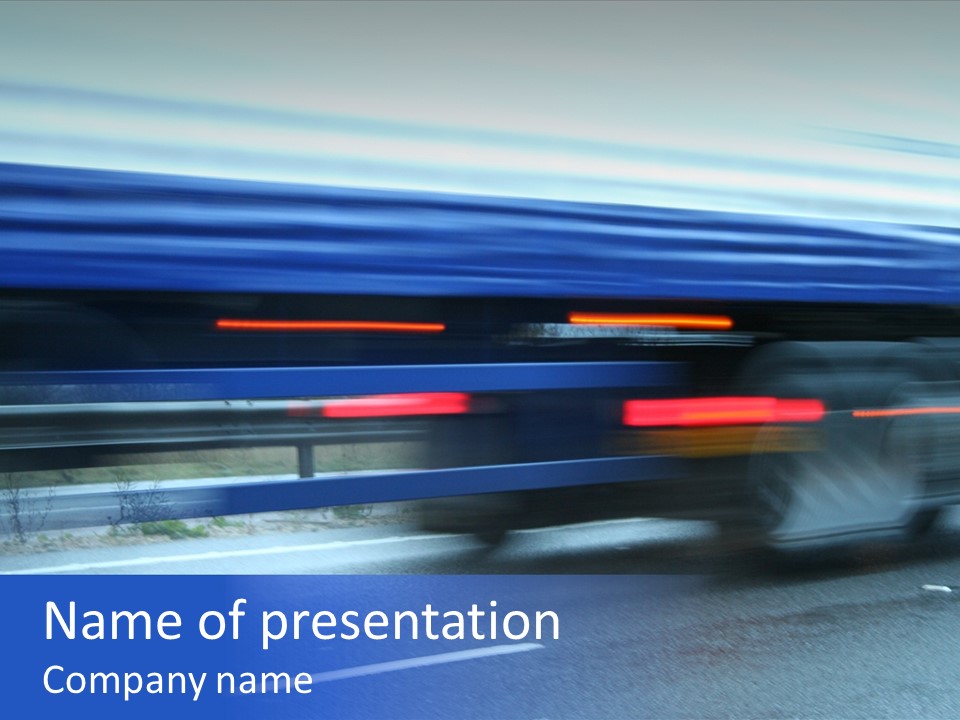 A Blue Truck Driving Down A Road With A Blue Tarp Over It PowerPoint Template