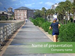 Active Locals And Sightseers Enjoy The Battery On The Ocean In Charleston PowerPoint Template