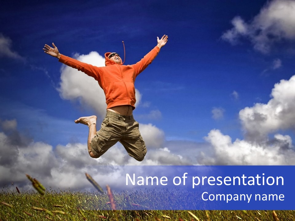 Man Jumping On A Green Meadow With A Beautiful Cloudy Sky PowerPoint Template