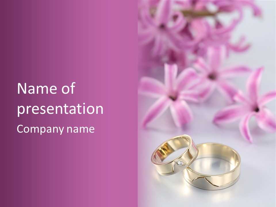 Two Gold Wedding Rings Sitting On Top Of A Table PowerPoint Template