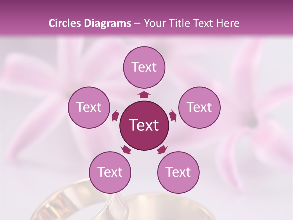 Two Gold Wedding Rings Sitting On Top Of A Table PowerPoint Template