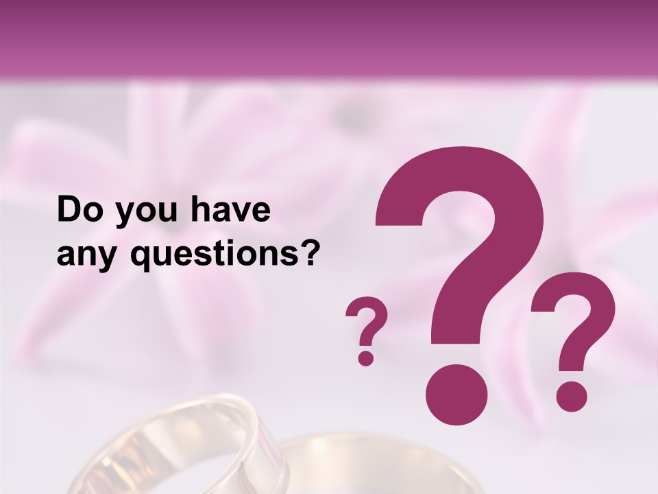 Two Gold Wedding Rings Sitting On Top Of A Table PowerPoint Template