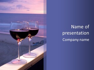 Two Glasses Of Red Wine Sitting On A Ledge Over Looking The Beach, Ocean And Beautiful Sunset. PowerPoint Template