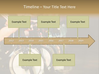 Active Lifestyle - Men & Women Pedalling On Stationery Bikes - Shallow Dof Focus On The Second Bike PowerPoint Template