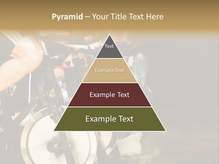 Active Lifestyle - Men & Women Pedalling On Stationery Bikes - Shallow Dof Focus On The Second Bike PowerPoint Template