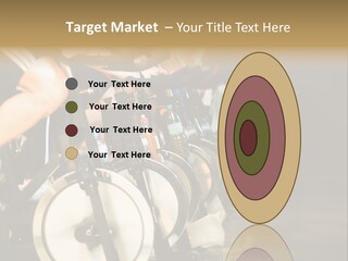 Active Lifestyle - Men & Women Pedalling On Stationery Bikes - Shallow Dof Focus On The Second Bike PowerPoint Template