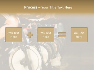 Active Lifestyle - Men & Women Pedalling On Stationery Bikes - Shallow Dof Focus On The Second Bike PowerPoint Template