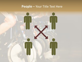 Active Lifestyle - Men & Women Pedalling On Stationery Bikes - Shallow Dof Focus On The Second Bike PowerPoint Template