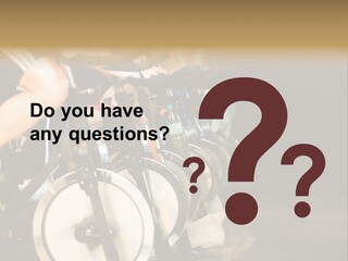 Active Lifestyle - Men & Women Pedalling On Stationery Bikes - Shallow Dof Focus On The Second Bike PowerPoint Template