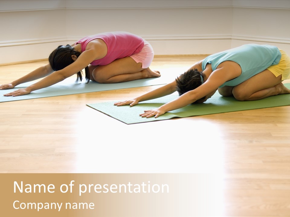 Two Young Women On Yoga Mats Doing Child's Pose. PowerPoint Template