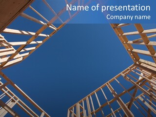 New Residential Construction Home Framing Against A Deep Blue Sky. PowerPoint Template